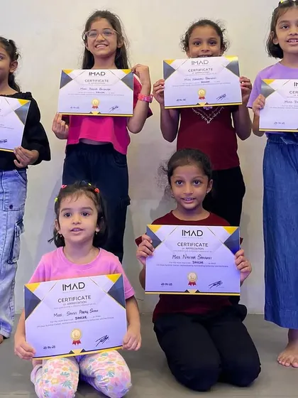Another group of smiling students with their certificates from the IMAD summer camp.