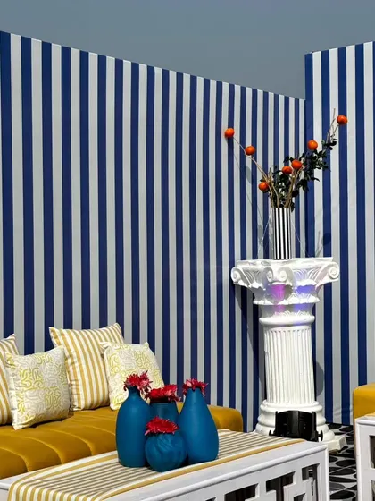 From concept to execution in just 42 hours. This St. Tropez inspired decor in Ahmedabad involved transforming a bungalow with custom-painted walls, fruit-based installations, and unique props, all on a tight deadline.