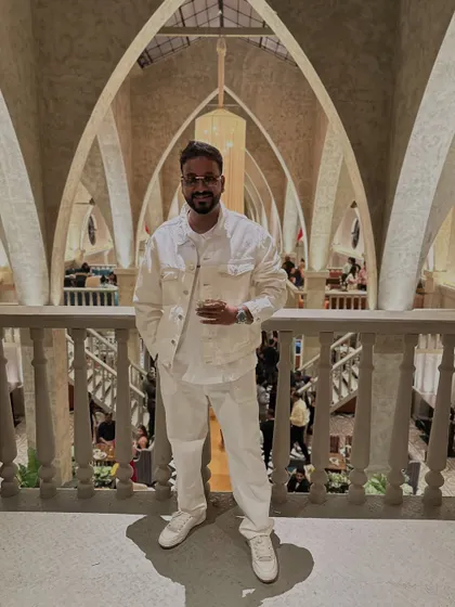 An all-white outfit for the grand launch party of Atlantis. It's important to match the vibe of the event.