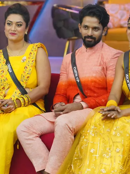 A shot of Karthik Mahesh in the Bigg Boss house, wearing a custom ethnic piece. The ombre effect on the jacket adds a modern touch to the traditional silhouette.