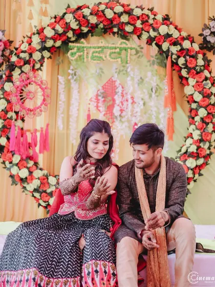 The couple seated in front of their beautiful floral Mehendi backdrop. I ensure to capture the decor and ambiance of your event.