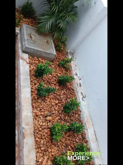 Another view of a pebble garden bed. This is a great way to landscape small or narrow spaces around your home.