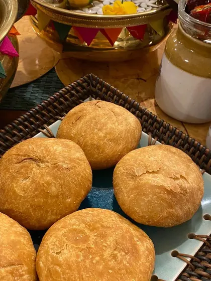 Freshly fried, golden-brown Matar Kachoris, a perfect savoury snack for any festival or tea-time gathering. We also offer onion and daal kachori varieties.