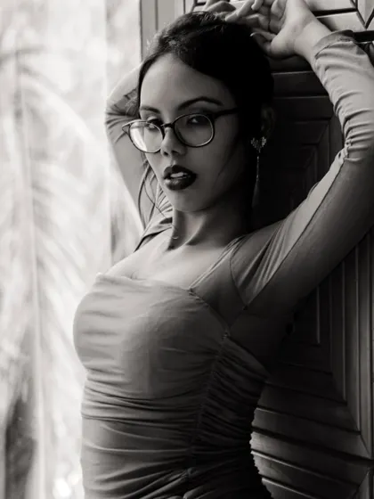 The same look translated into a dramatic black and white portrait. The bold lip and defined eyes create a powerful, high-contrast image.