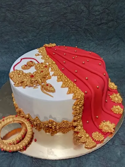 Celebrating tradition with a modern twist, this saree-themed cake is one of my favorite creations. The detailed, edible fabric draping, intricate gold jewelry, and floral patterns make it a beautiful centerpiece for cultural celebrations.
