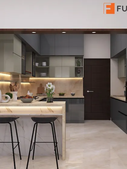This U-shaped kitchen uses a neutral color palette with grey acrylic cabinets and a marble-effect countertop. A breakfast bar with under-lighting adds to the modern, luxurious feel.