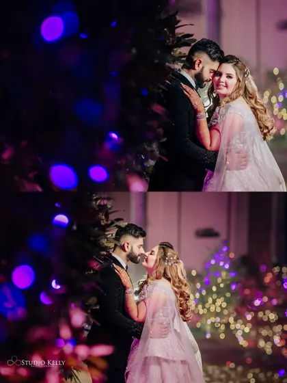 A romantic night-time shot of the couple, with the beautiful bokeh of purple lights in the background.