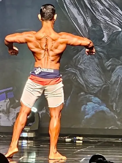 A closer look at the back conditioning required to be competitive. This level of detail in the lower back and glutes is the result of a meticulous nutrition and training protocol, which I customize for every athlete I coach.