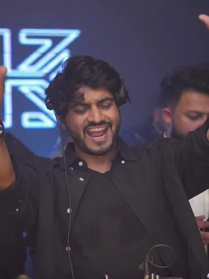 Hands up, pure celebration. This is the energy when the crowd's moves perfectly match the beats I'm dropping.