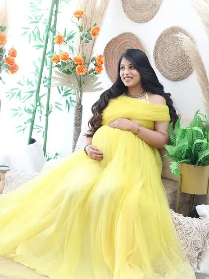 A ray of sunshine in our boho corner. The bright yellow tulle gown contrasts beautifully with the earthy tones of the pampas grass and jute decor.