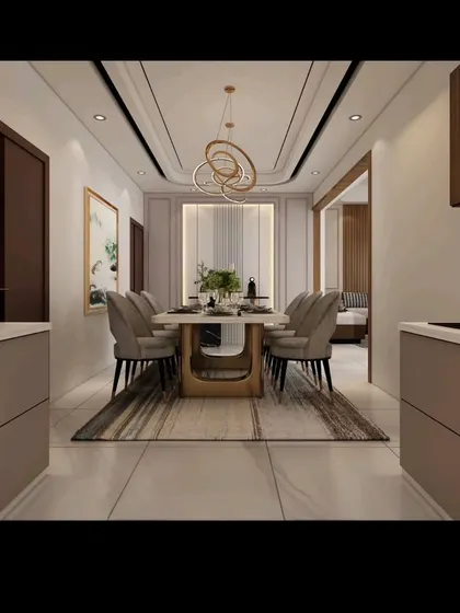 A perspective view showing the flow from the kitchen to the dining area in one of our projects. The design ensures a seamless transition between spaces, making it ideal for modern family living and entertaining guests.