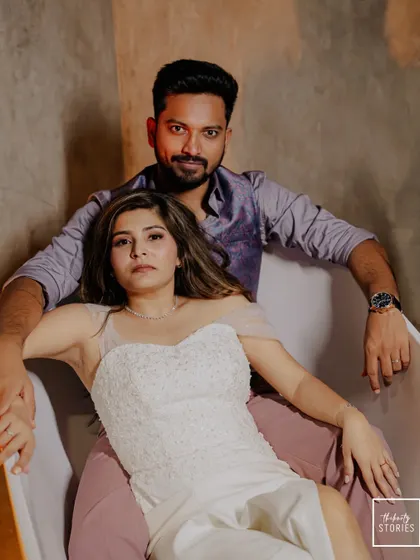 The couple shares an intimate and stylish moment together in a bathtub, a unique and artistic portrait from their Goa photoshoot.