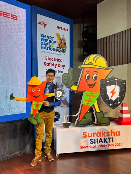 Posing with both the 'Suraksha Shakti' mascot and the puppet version we created. It's a great example of bringing a 2D character into the 3D world.