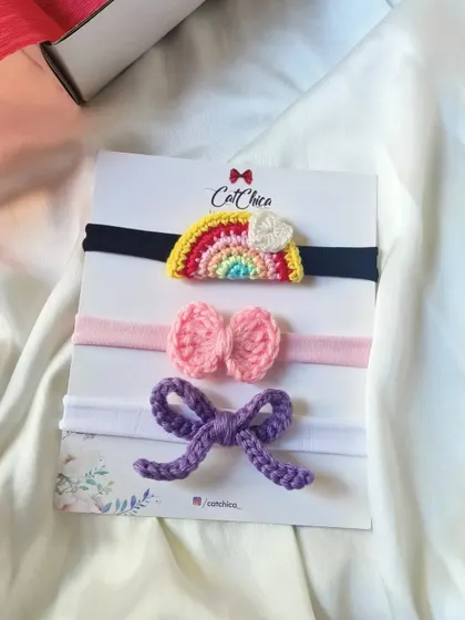 A closer look at our rainbow-themed newborn headband set, made with soft elastic for a gentle fit.