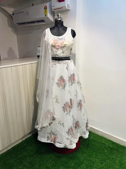 A full shot of the white floral lehenga, perfect for renting for a summer wedding. The look is fresh, modern, and effortlessly chic.