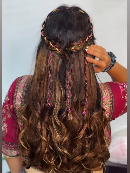 The back view of the ribbon and braid hairstyle, a perfect look for a Mehendi.
