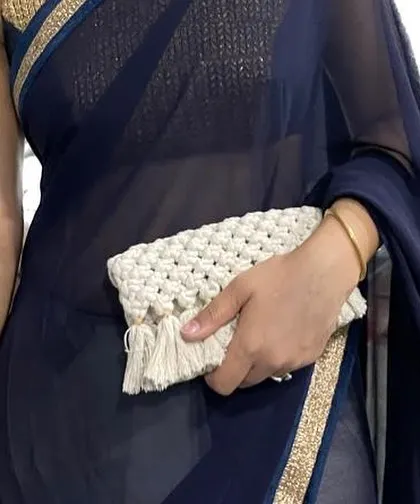 My boho clutch is perfect for ethnic wear too! Here it is paired with a beautiful saree. It's small enough to be elegant but big enough for your essentials.