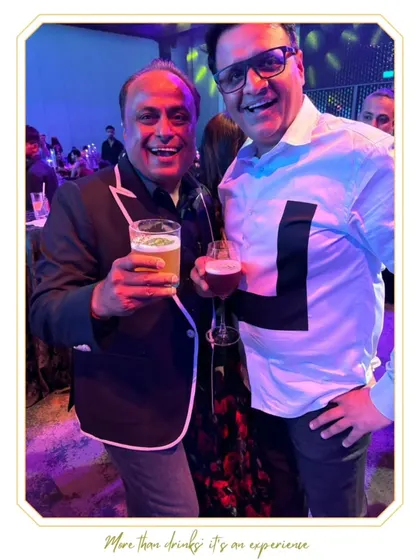A happy guest enjoying a beer at a wedding reception. Alongside our cocktails, we provide a full bar service to cater to all preferences.