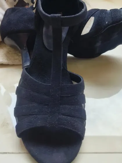 This top-down view showcases the classic open-toe silhouette and the quality of the black suede. It's a durable and comfortable shoe built to last through countless dances, from your first lesson to advanced socials.