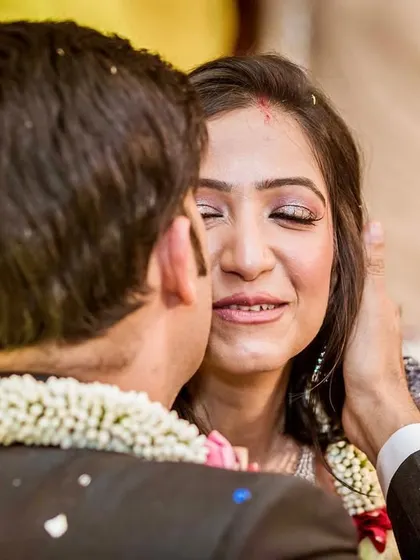 A tender kiss on the cheek, a moment of pure emotion for the bride. Capturing these fleeting expressions is what makes a photo story complete.