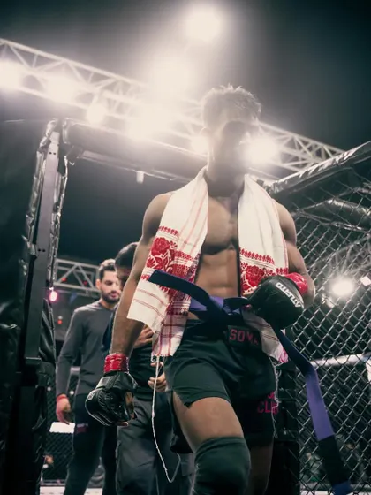 The walk to the cage. A warrior ready for battle, carrying the legacy of his training and the spirit of his team.