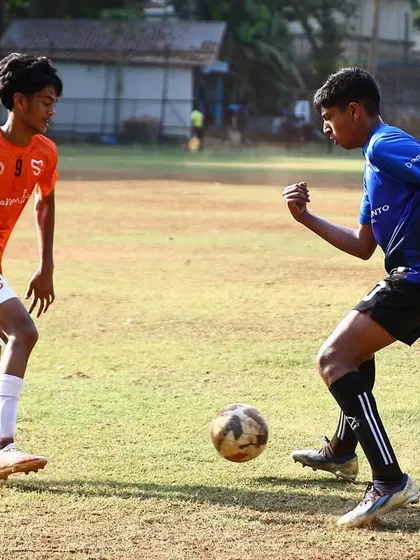 A one on one duel on the pitch. Our players are trained to be confident and decisive in these key moments of the game.
