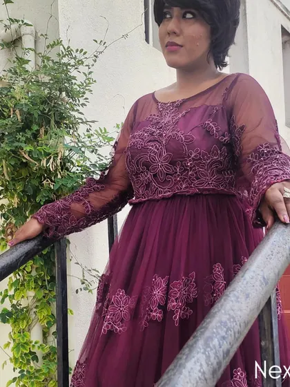 A profile shot on the stairs in the purple gown. The intricate lacework and sheer sleeves of this dress were just stunning.
