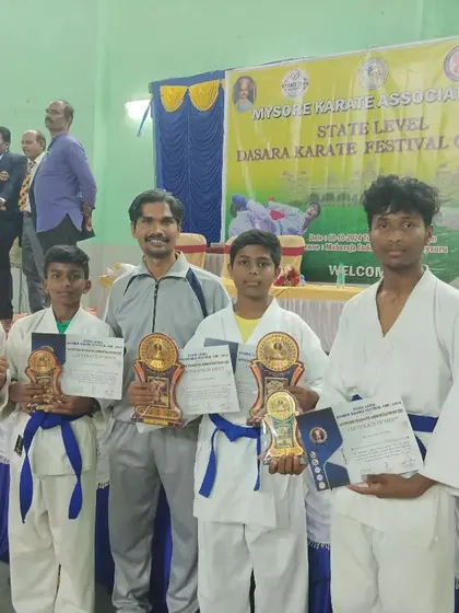 The team after winning multiple prizes at the Mysore Dasara Karate Championship. It was a proud event for our school.
