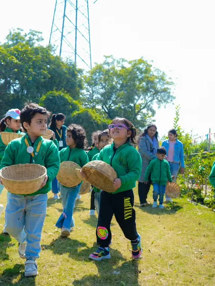 Students with their baskets, ready for a day of harvesting. This activity teaches them about different vegetables and the basics of farming.