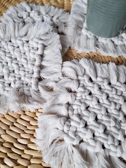 A full set of the square woven coasters, ready for a get-together with friends. They are both functional and decorative.
