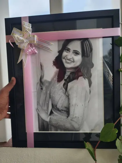A beautifully wrapped and framed portrait, ready for gifting.