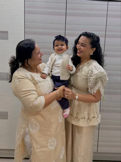 Another beautiful moment from the same series, this time with all of us looking at each other and smiling. It captures the love and connection between a daughter, mother, and grandmother.