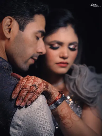 A beautiful close up portrait capturing the bride's intricate henna and her loving embrace. The details in this shot tell a story of tradition and love.