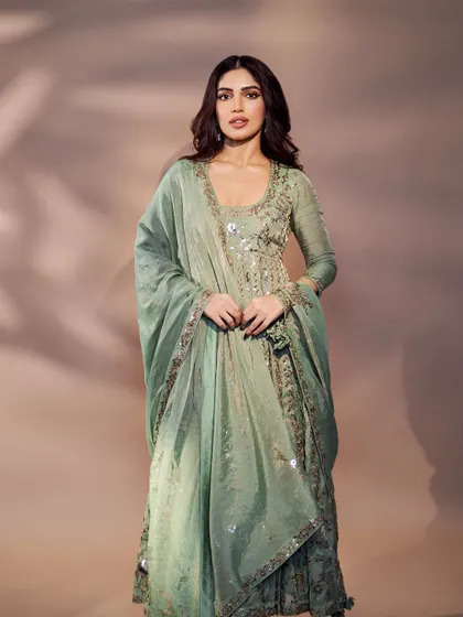 A full-length view of Bhumi's mint green Anarkali, showing the beautiful flare and the delicate dupatta.