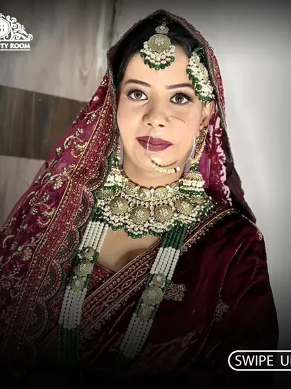 A beautiful portrait of a bride looking confident and poised. The makeup features a deep lip color and defined eyes, perfect for a traditional evening ceremony.