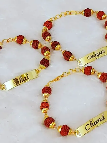 A set of three rudraksh bracelets with personalized nameplates, perfect to be used as rakhis.