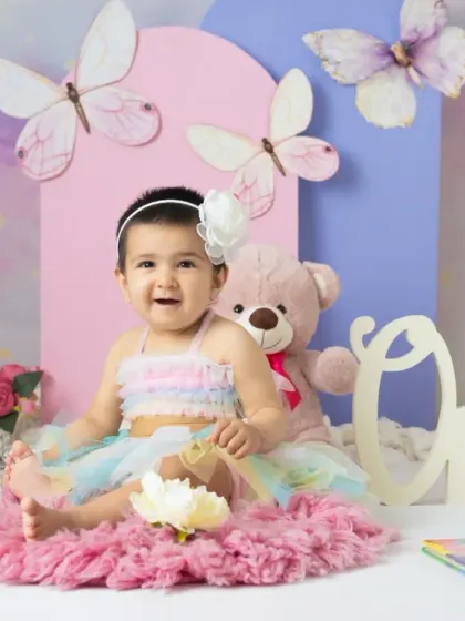 A magical unicorn and butterfly theme for a first birthday. The pastel colors, whimsical props, and dreamy backdrop create a true fairy tale setting.