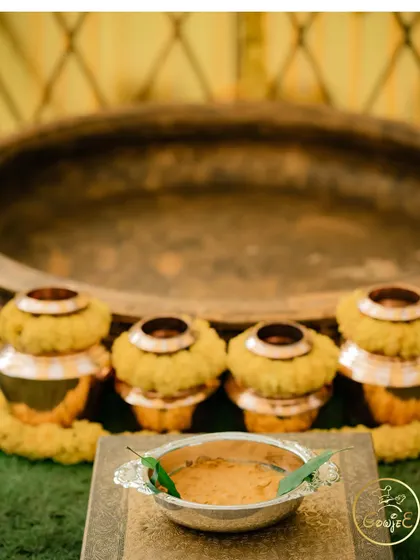 A detailed shot of the traditional pots and the Haldi paste, ready for the ceremony.