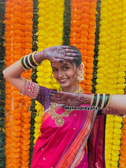Henna celebrations with the 'Durga' family. A happy, smiling shot of actress Rumani Khare showing off her bridal mehendi for the show.