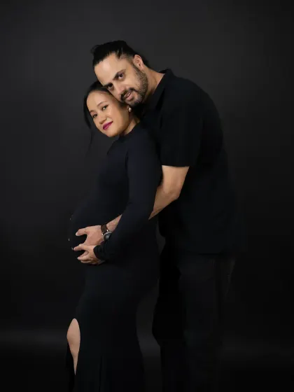 We guide you through a variety of poses to find what feels most comfortable and looks best. This classic embrace is a beautiful way to showcase your connection and the baby bump.
