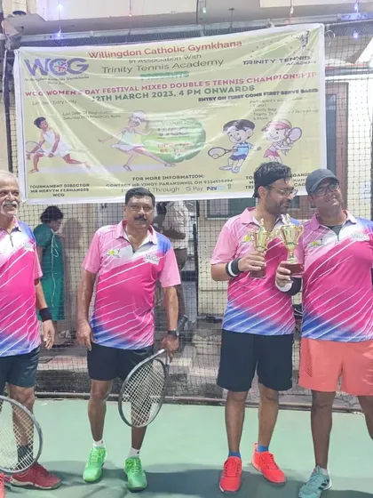 The runners-up of the Men's Doubles event with their trophies, showcasing the high level of competition.