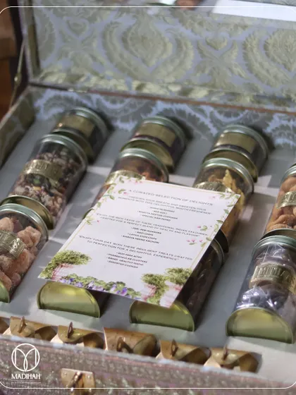 This Bhaji box includes a personalized menu card, detailing the selection of gourmet snacks and sweets inside. It's a thoughtful touch that elevates the gifting experience.