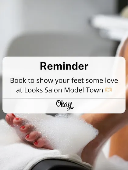 This is your friendly reminder to book some well deserved me time. A client's feet are seen soaking in a bubbly, cleansing foot bath, the first step towards total relaxation.