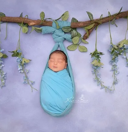 A beautiful hanging pose against a simple lavender backdrop. Mini sessions are perfect for capturing one or two stunning, artistic shots like this.