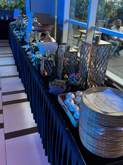 For a corporate dinner for L'Oréal India, we created a sophisticated buffet line. The setup featured elegant lanterns and a dark linen theme to match the brand's glamorous style, complete with a full range of our vegetarian dishes.