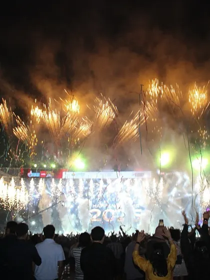 The audience captures the magnificent fireworks show on their phones. We design our events to be visually spectacular from every angle, creating countless shareable moments for attendees.