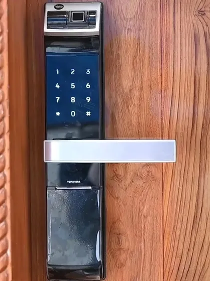 A close-up of our smart door lock. It offers multiple ways to unlock, including fingerprint, passcode, key card, and through the mobile app.