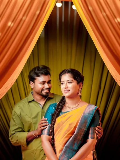 Another angle from the same indoor setup, capturing a sweet, candid moment between the couple.