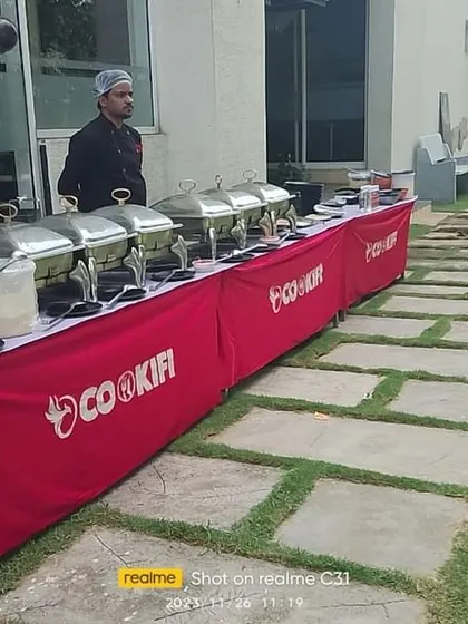 A long shot of our outdoor buffet setup for a kid's birthday party, showing how we can cater in various environments, from indoor halls to open lawns.