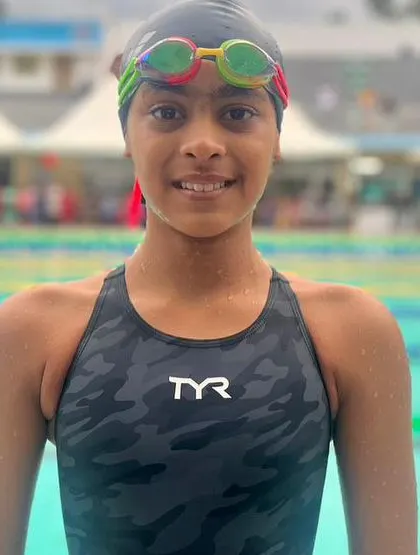 A duplicate image of a young female swimmer ready to compete.
